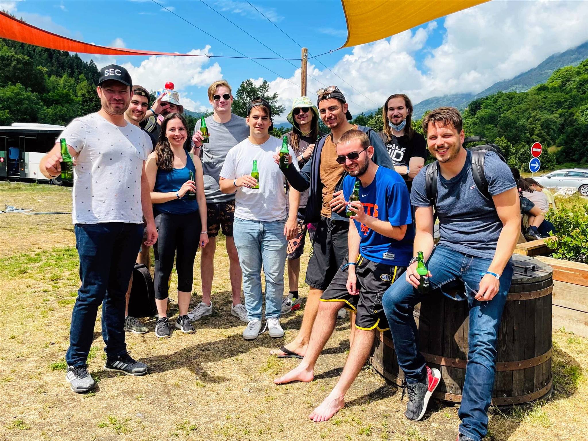 The 8SEC team celebrating together at a summer team off-site in the mountains